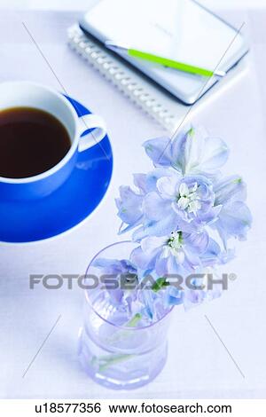Stock Photograph - Coffee and Vase of Flowers. Fotosearch