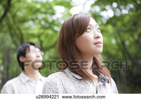 Stock Image - Couple looking up. Fotosearch