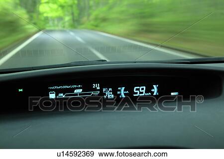 Stock Photo - Driving a hybrid car. Fotosearch