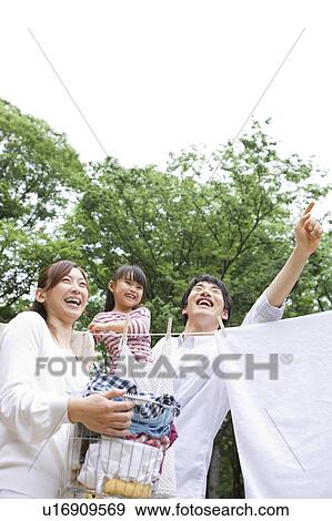 Stock Photo - Family doing laundry. Fotosearch