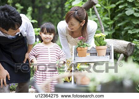 Stock Photography - Family gardening. Fotosearch