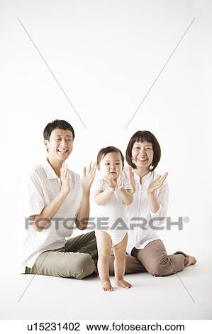 Stock Image - Family of Three Clapping. Fotosearch