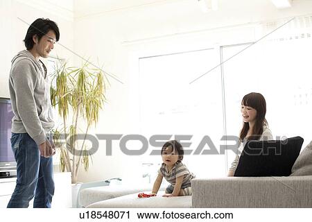 Family of Three in Living Room View Large Photo Image Stock Image - Family of Three in Living Room. Fotosearch