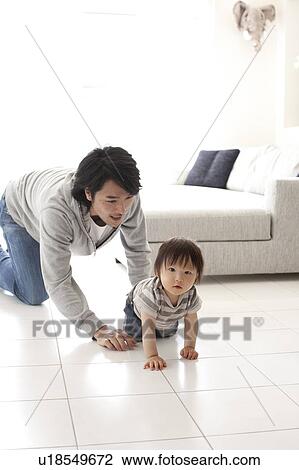 Father and Baby Boy Crawling in Living Room Floor View Large Photo Image Stock Image - Father and Baby Boy Crawling in Living Room Floor. Fotosearch
