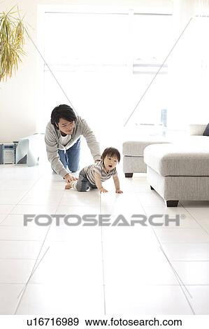 Father and Baby Boy Crawling in Living Room View Large Photo Image Stock Photo - Father and Baby Boy Crawling in Living Room. Fotosearch
