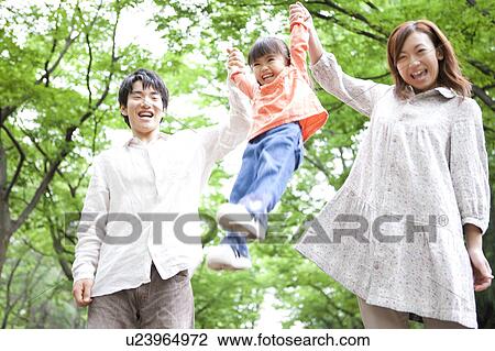 Father and mother lifting their daughter up View Large Photo Image Stock Image - Father and mother lifting their daughter up. Fotosearch