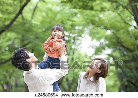Father picking up daughter View Large Photo Image Picture - Father picking up daughter. Fotosearch