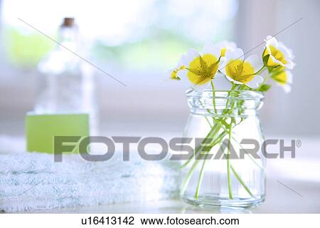 Stock Image - Flowers and Toiletries. Fotosearch