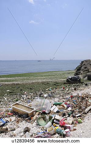 Stock Photograph - Garbage on beach, Urayasu City, Chiba Prefecture, Honshu, Japan. Fotosearch