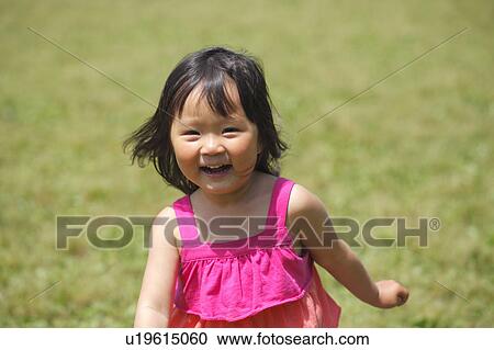 Girl Running in Park View Large Photo Image Stock Image - Girl Running in Park. Fotosearch