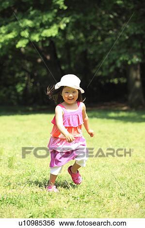 Stock Photograph - Girl Running in Park. Fotosearch