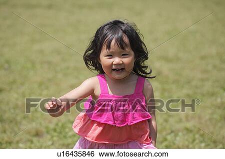 Girl Running in Park View Large Photo Image Stock Photograph - Girl Running in Park. Fotosearch