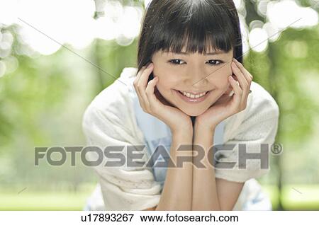 Stock Photo - Happy Young Woman. Fotosearch