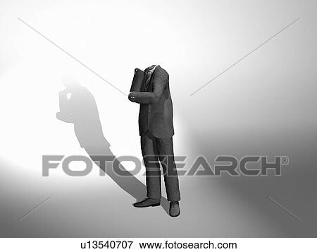 Invisible businessman thinking, digitally generated image View Large Photo Image Stock Photo - Invisible businessman thinking, digitally generated image. Fotosearch