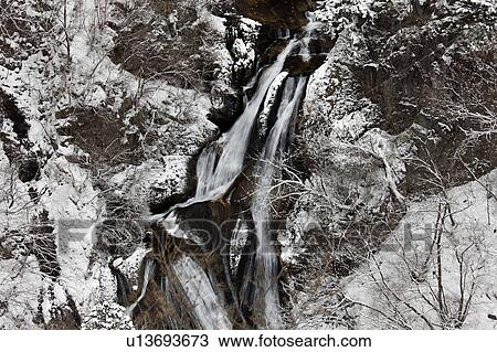 Stock Image - Kirifuki Falls in Winter. Fotosearch