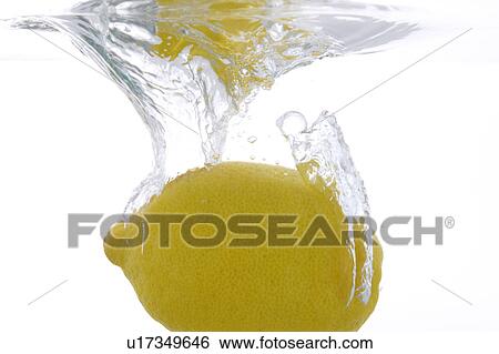 Stock Photograph - Lemon falling into water. Fotosearch