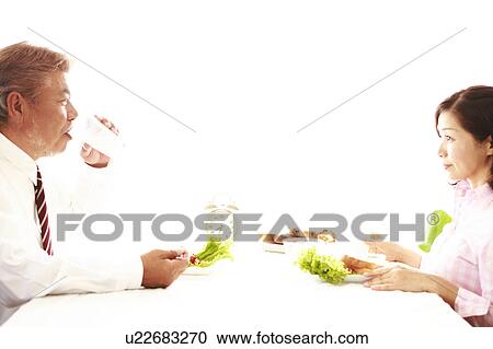 Mature couple eating breakfast View Large Photo Image Stock Image - Mature couple eating breakfast. Fotosearch