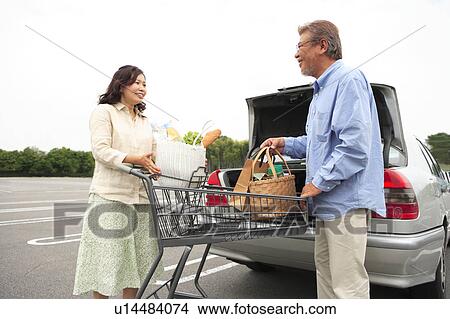 Mature Couple Loading Boot of Car with Shopping View Large Photo Image Picture - Mature Couple Loading Boot of Car with Shopping. Fotosearch