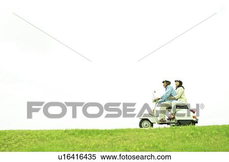 Mature couple on moped View Large Photo Image Stock Photography - Mature couple on moped. Fotosearch