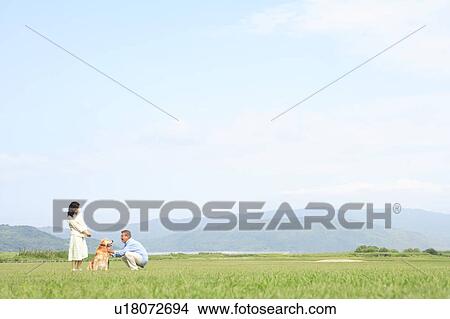 Picture - Mature Couple with Dog. Fotosearch
