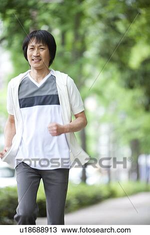 Stock Image - Mature man jogging. Fotosearch