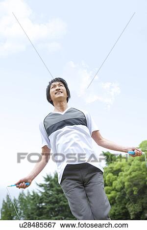 Stock Photo - Mature man jumping rope. Fotosearch