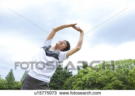 Stock Image - Mature man stretching. Fotosearch