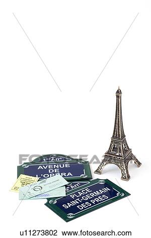 Stock Image - Miniature Eiffel tower, road signs and tickets. Fotosearch