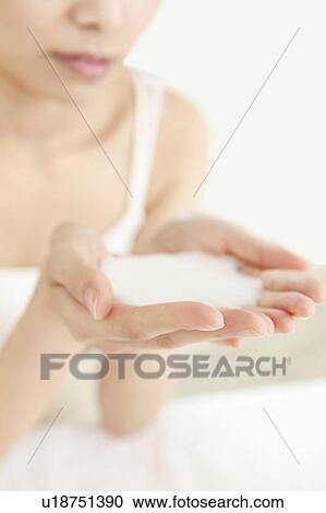 Moisturiser in Woman's Cupped Hands View Large Photo Image Stock Image - Moisturiser in Woman's Cupped Hands. Fotosearch