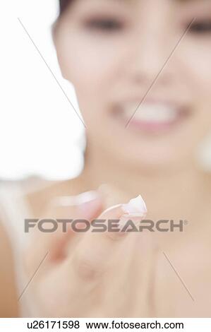 Stock Photo - Moisturiser on Fingertip. Fotosearch