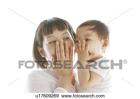 Mother and Baby with Hand Over Mouth View Large Photo Image Stock Photo - Mother and Baby with Hand Over Mouth. Fotosearch