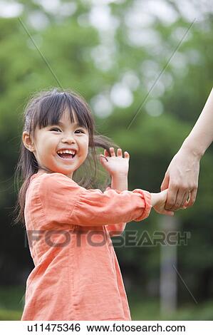 Mother and daughter holding hands View Large Photo Image Stock Photograph - Mother and daughter holding hands. Fotosearch