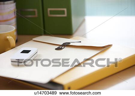 Office desk and cell phone View Large Photo Image Stock Photo - Office desk and cell phone. Fotosearch