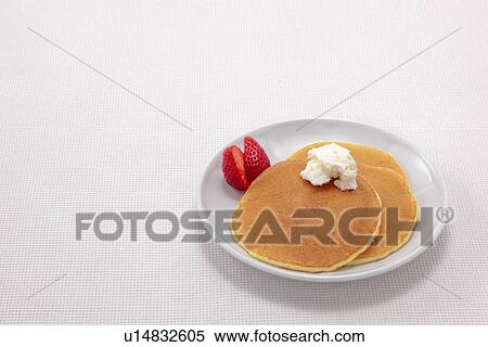 Stock Photography - Pancakes with Cream and Strawberries. Fotosearch