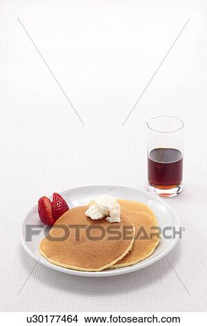 Picture - Pancakes with Strawberries and Maple Syrup. Fotosearch