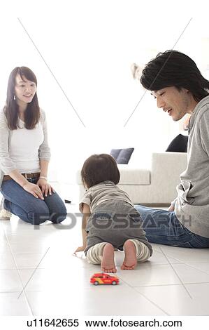 Parents Watching Baby Boy Crawling View Large Photo Image Stock Photography - Parents Watching Baby Boy Crawling. Fotosearch