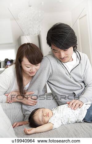 Parents Watching Baby Boy Sleeping View Large Photo Image Picture - Parents Watching Baby Boy Sleeping. Fotosearch
