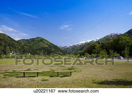Stock Photo - Park, Mountains in Background. Fotosearch