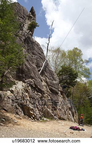 Stock Image - Person Rock Climbing. Fotosearch