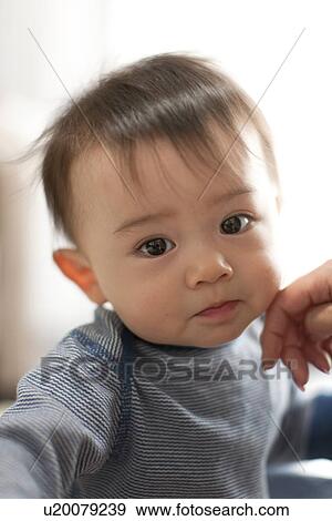Person Touching Baby's Cheek View Large Photo Image Stock Photo - Person Touching Baby's Cheek. Fotosearch
