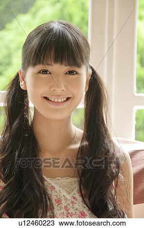 Stock Image - Portrait of Young Woman. Fotosearch