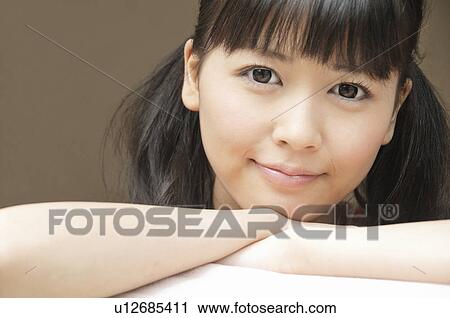 Stock Image - Portrait of Young Woman. Fotosearch