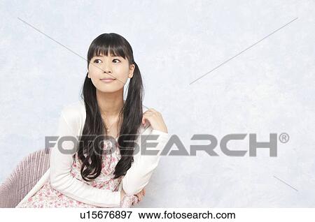 Stock Photo - Portrait of Young Woman. Fotosearch