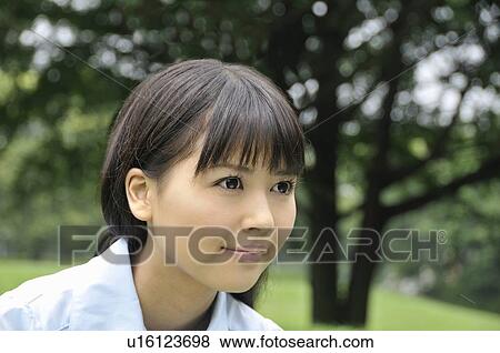 Stock Photo - Portrait of Young Woman. Fotosearch