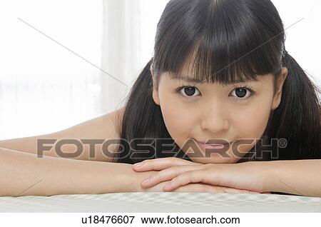 Stock Photo - Portrait of Young Woman. Fotosearch