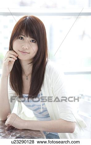 Stock Photo - Portrait of young woman. Fotosearch