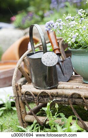 Picture - Potted flowers and gardening equipments. Fotosearch