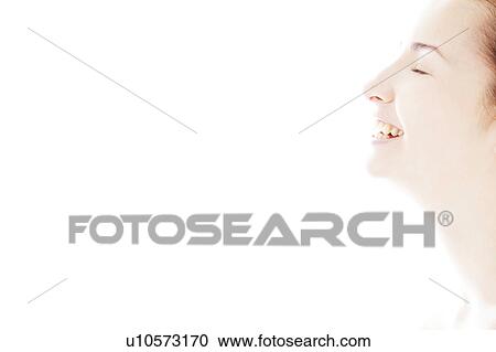 Stock Image - Profile of a young woman smiling. Fotosearch