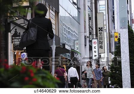 Stock Photo - Shoppers in Ginza, Chuo Ward, Tokyo Prefecture, Japan. Fotosearch