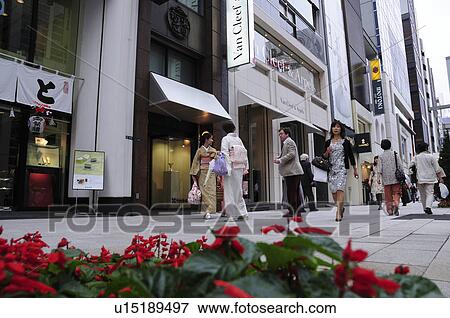 Stock Photo - Shoppers in Ginza, Chuo Ward, Tokyo Prefecture, Japan. Fotosearch